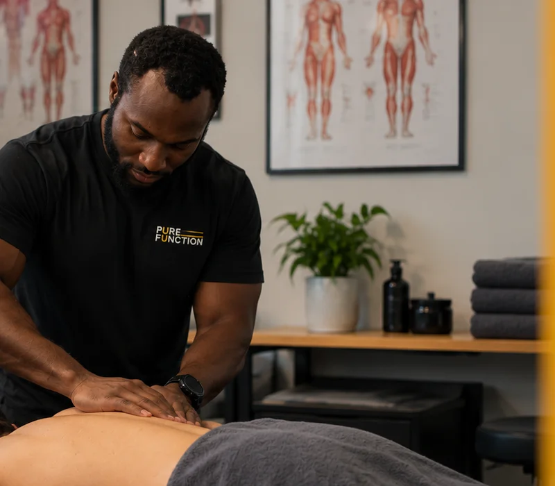 DeMarcus Crawford providing hands-on manual therapy to a client