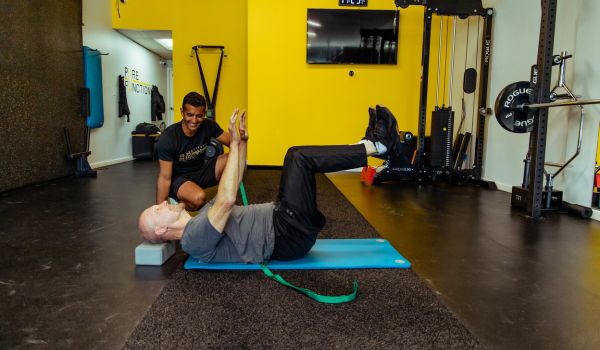 corrective exercise being shown by personal trainer