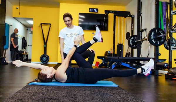 woman trainer teaching diaphragmatic breathing